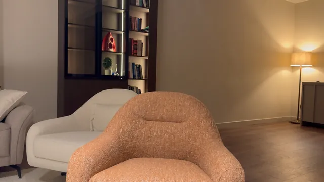 Input scene: a lamp-lit living room with an orange armchair
